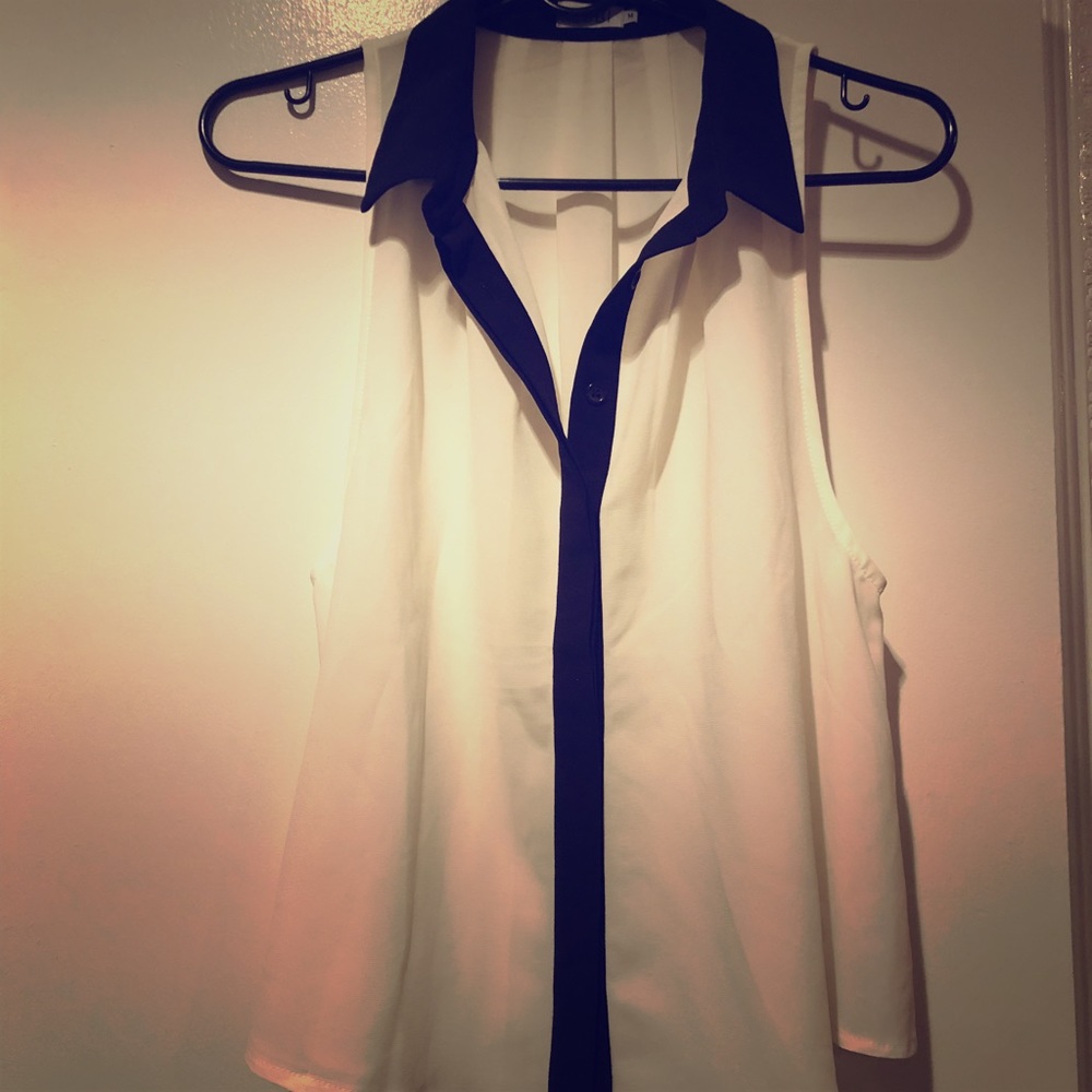 Brand new white blouse with a black collar